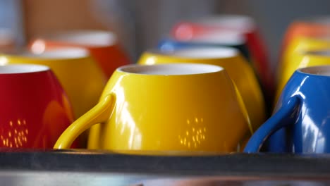 colorful mugs in a cafe setting