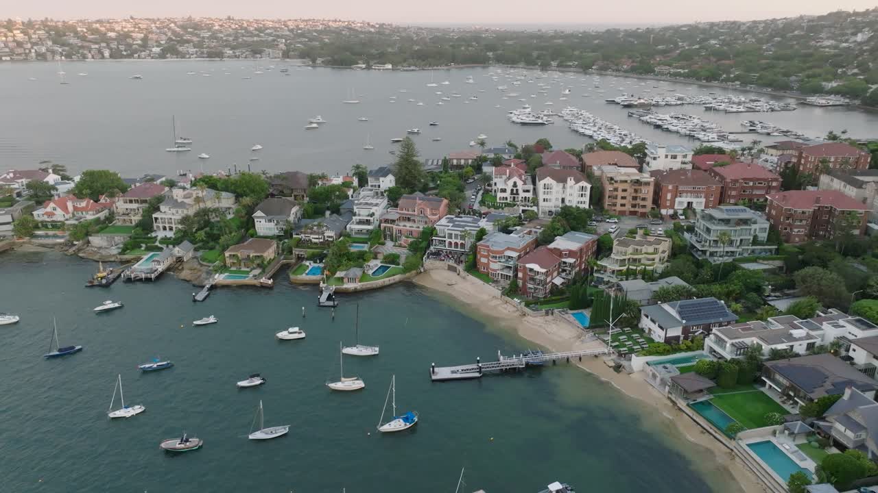 Luxurious waterfront homes with boats in sydney's point piper area, aerial view