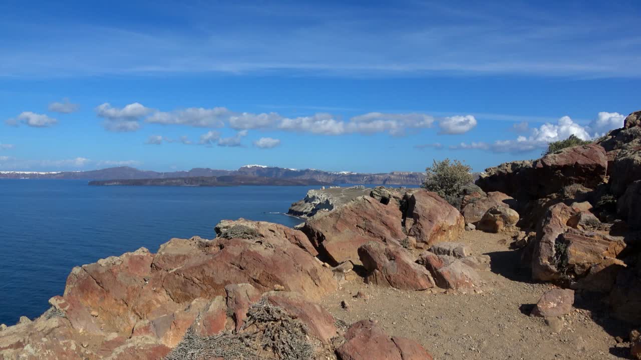 Stunning View of the Aegean Sea from a Rocky Coast in Santorini, Greece