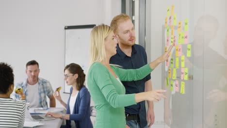 two coworkers brainstorming on scheme