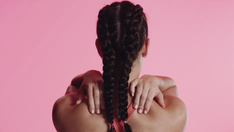 woman massaging her sore shoulder