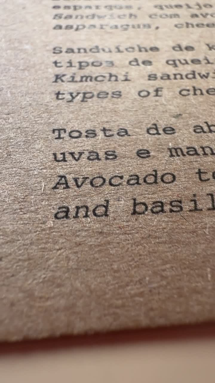 Close-up Pan of a Rustic Food Menu on Brown Paper