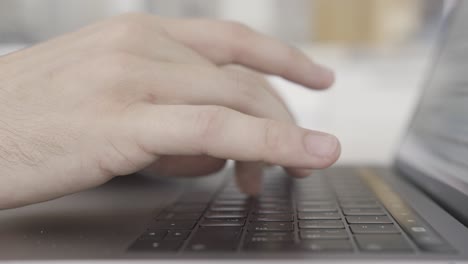 person typing on a laptop