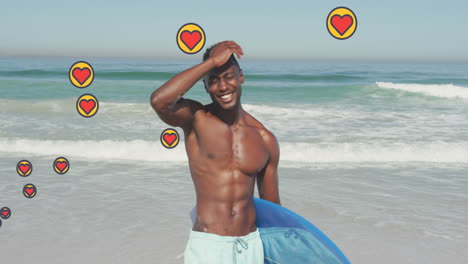 animación de iconos digitales de corazón sobre un hombre sosteniendo una tabla de surf en la playa
