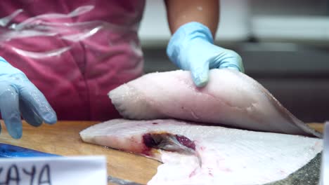 fishmonger filleting flatfish