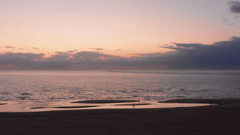 the beach of the island neeltje jans, the netherlands during sunset in summer