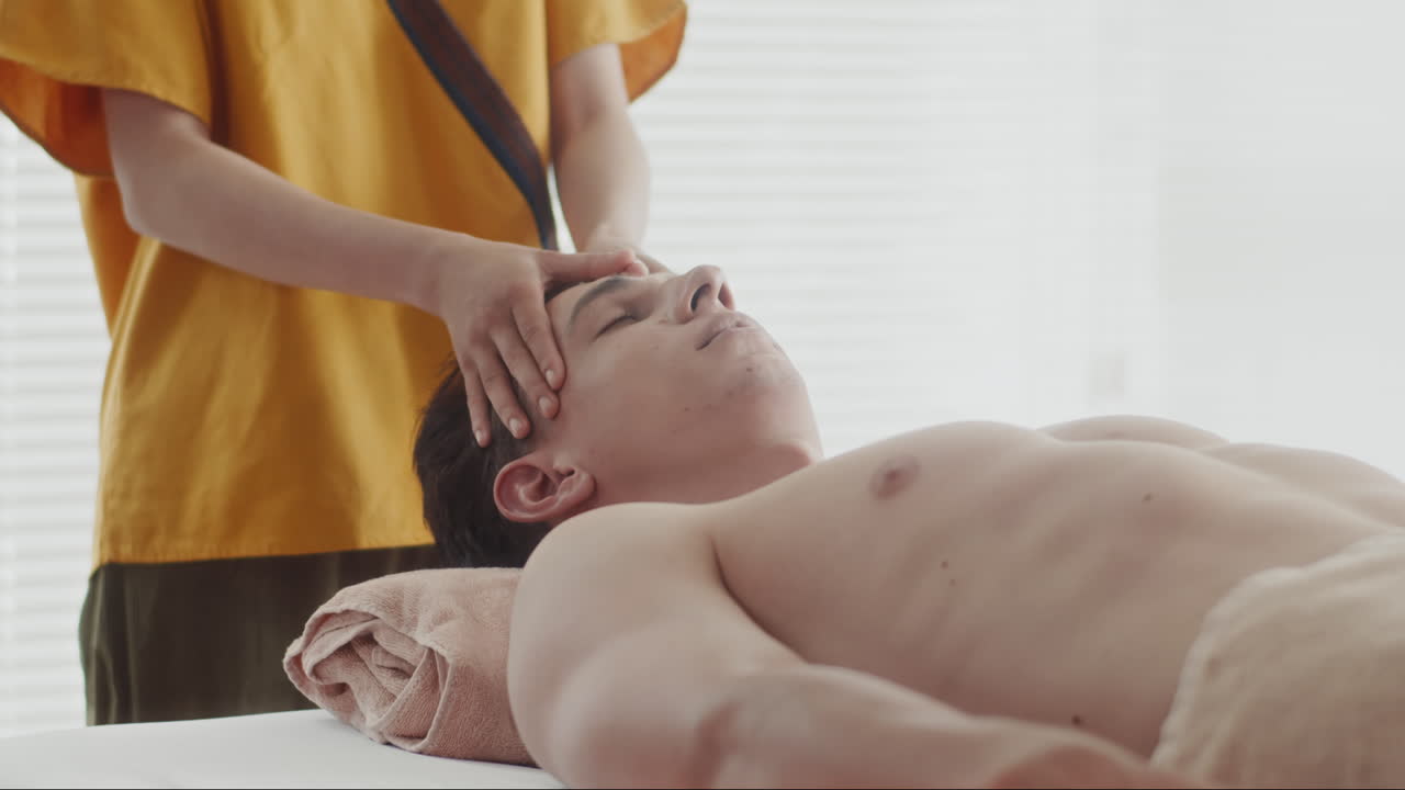 Masseuse Giving Anti-pain Head Massage