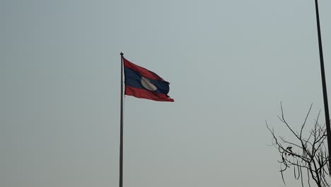 laos country flag waving before sunset