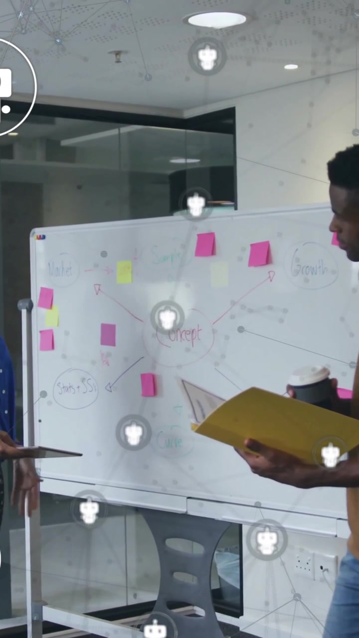 Animation of robot icons over diverse colleagues discussing work
