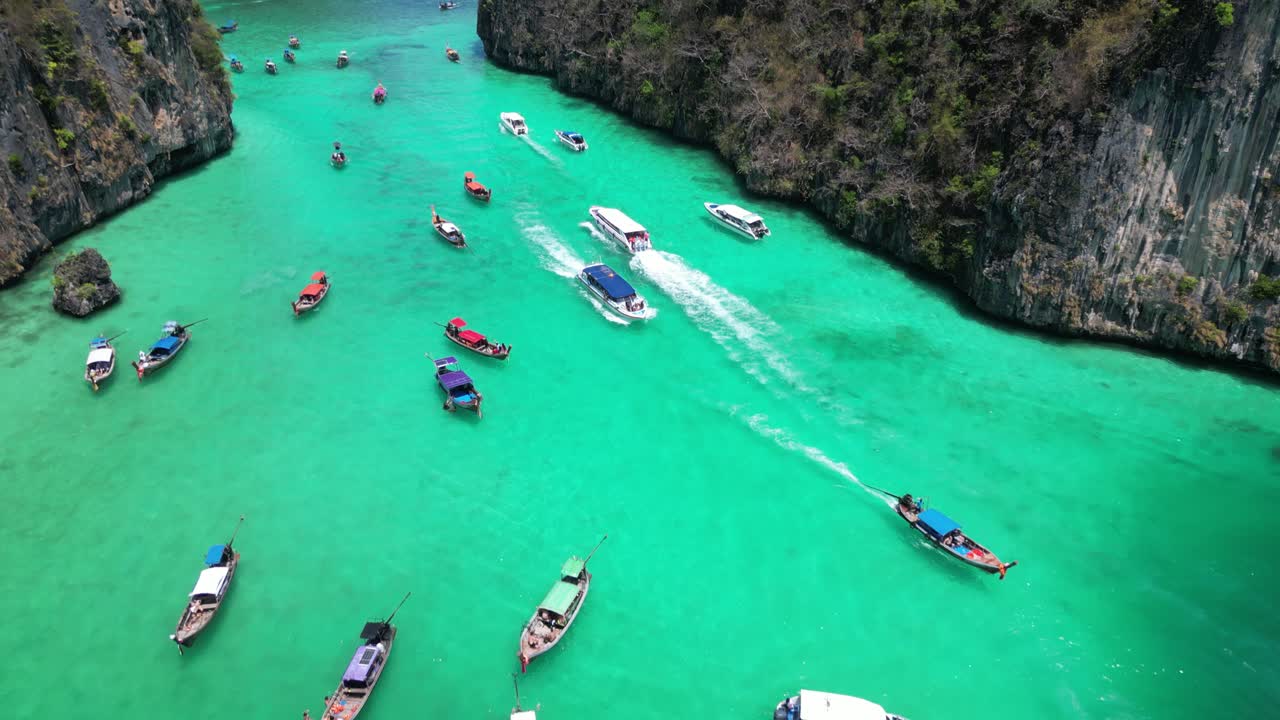 Tour Boats Traffic in Scenic Pi Leh Bay of Phi Phi Island, Drone View