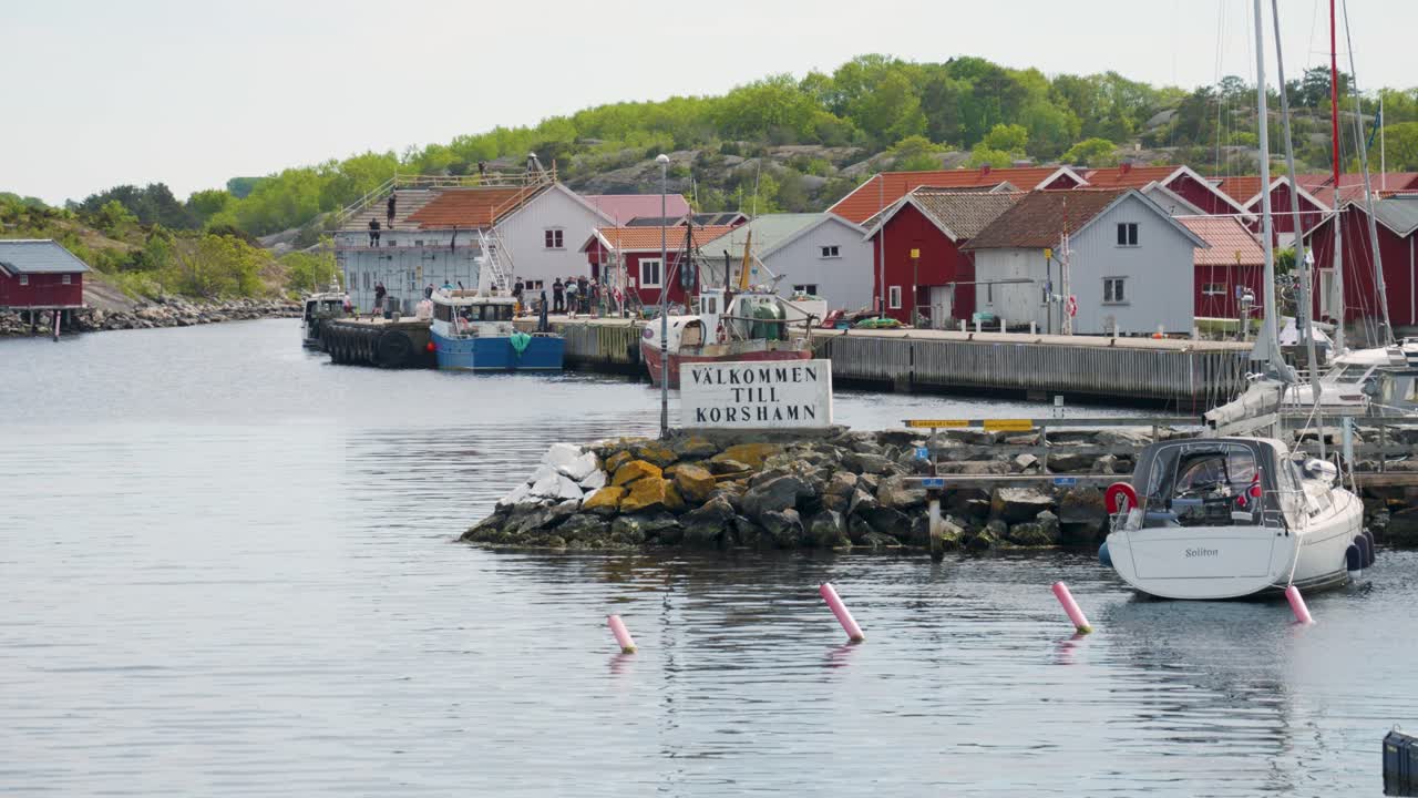 Welcome To Korshamn Signage In Swedish At The Harbor On Norwegian Border Near Bohuslan In West Sweden. wide shot
