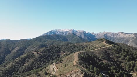 Aerial-view-of-Sierra-de-Las-Nieves,-moving-down