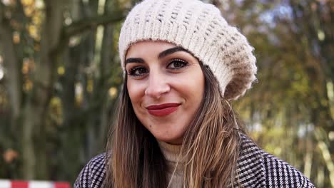 beautiful portrait of a happy young woman smiling and looking into the camera