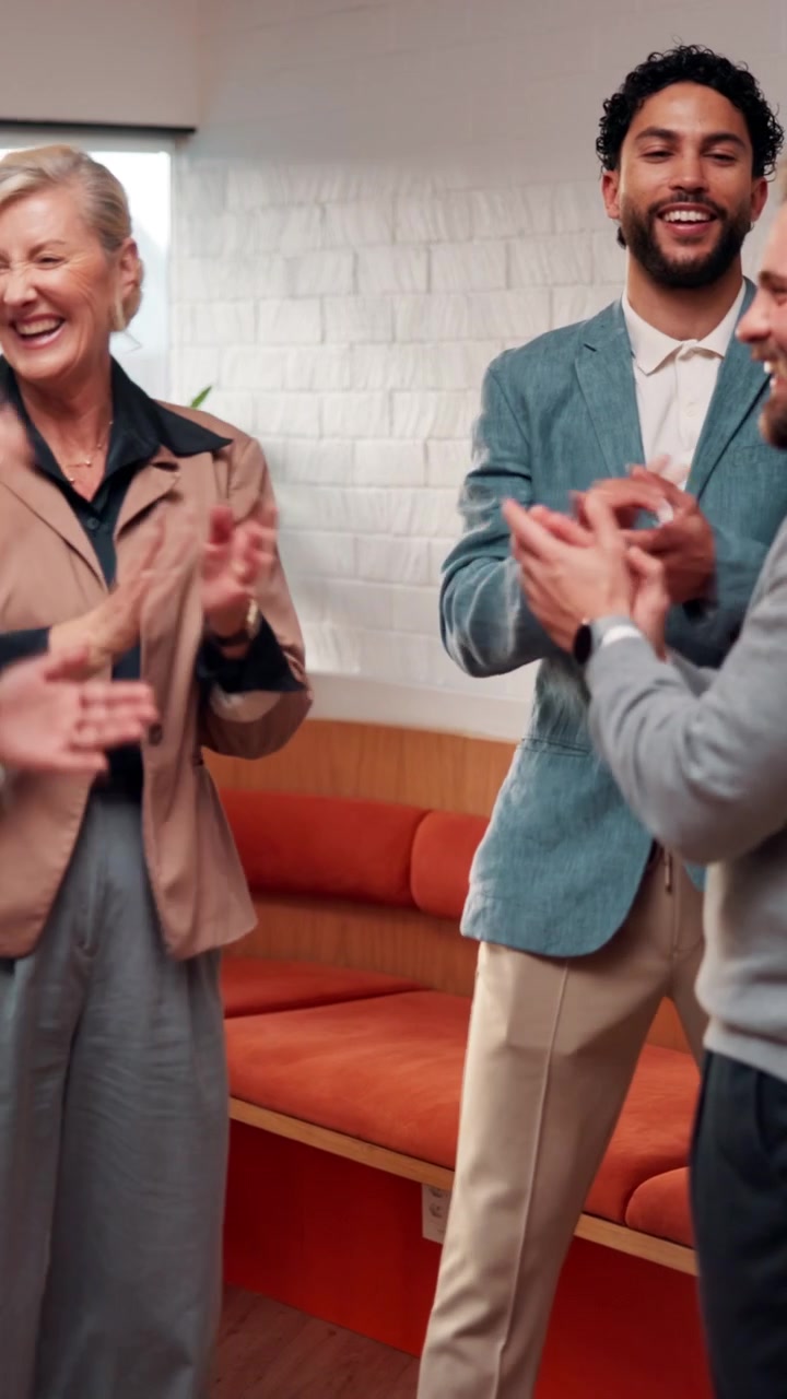 Diverse Business Team Celebrating Success with High Five and Clapping