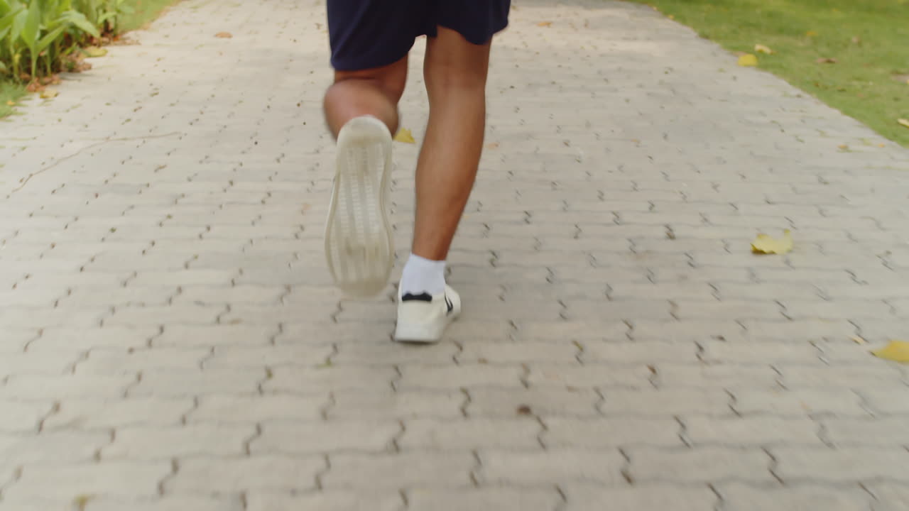 Professional Athlete Jogging Alone in Park
