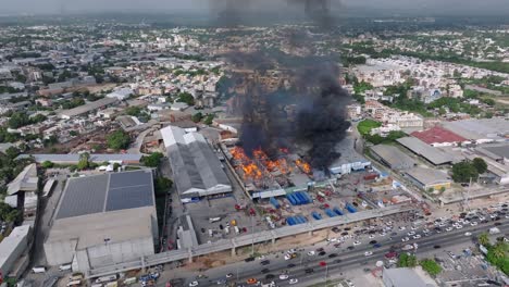 Massive Industrial Fire in City: Aerial View of Emergency Response
