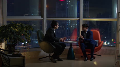 business meeting at night with city view