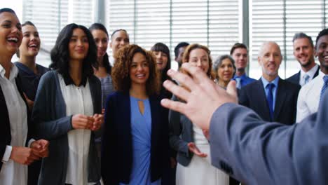 businesspeople applauding on their colleagues presentation