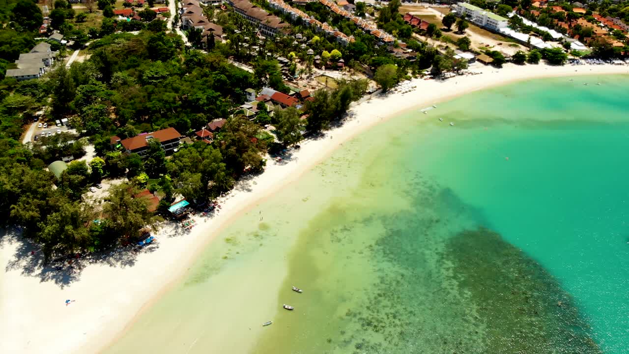 An overhead aerial drone shot that made a halfway orbit above Choeng Mon beach in the island of Koh Samui in Surat Thani province in Thailand
