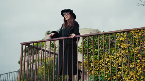 elegant woman waving happy to the people of her vintage hamlet