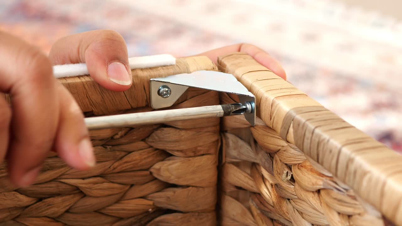 Assembling a Wicker Basket with Screwdriver and Corner Brace