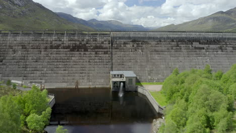 an aerial view of cluanie dam on loch cluanie on a nice day