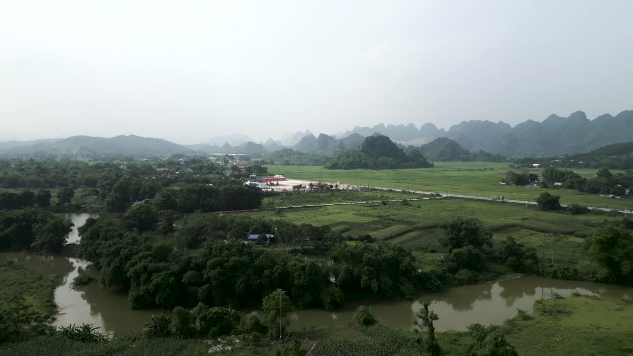 Vietnamese Countryside Landscape with Rice Paddies and Mountains