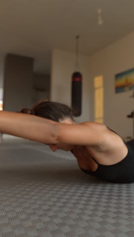 woman doing yoga or stretching exercise at home