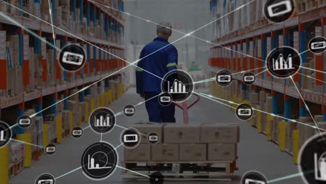 Network-of-digital-icons-against-rear-view-of-senior-male-worker-pulling-a-pallet-at-warehouse