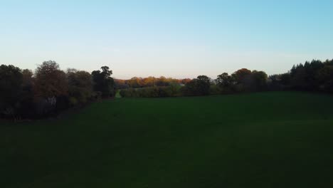 Elegant-Rising-Autumn-Aerial-View-of-Church-and-Countryside-English-Estate---Drone-Shot-4K