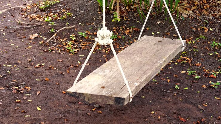 wooden swing in the garden