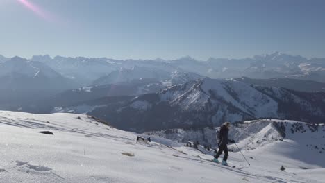 woman skiing down a snowy mountain