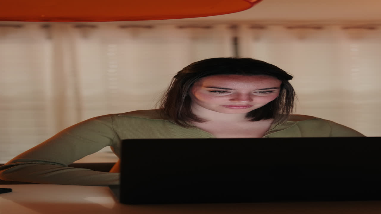 Portrait of CWoman Working From Home on Laptop at Night