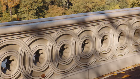 decorative circular design of carved stone ramp of pedestrian bridge in central park, new york manhattan