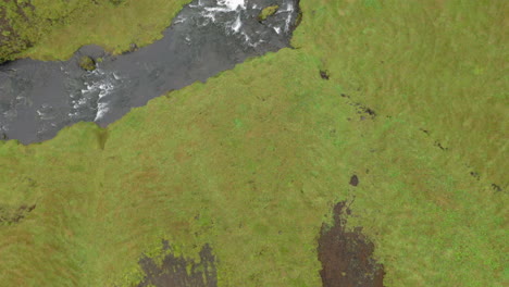 Aerial:-Top-down-reveal-shot-of-Kvernufoss-waterfall-in-Iceland