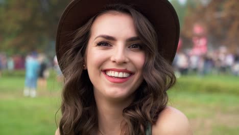 close up of caucasian woman looking at camera at music festival