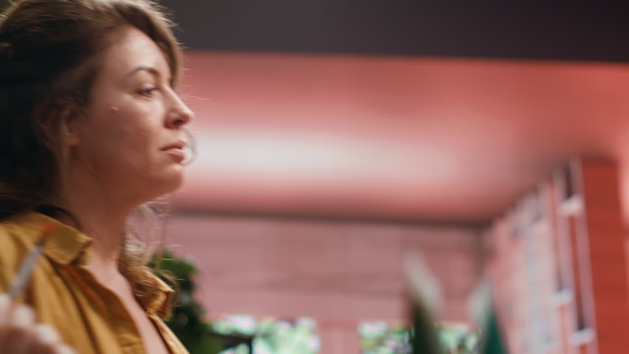 A woman painting in her art studio