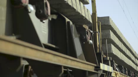 close-up view of train signal equipment mounted on a weathered bridge