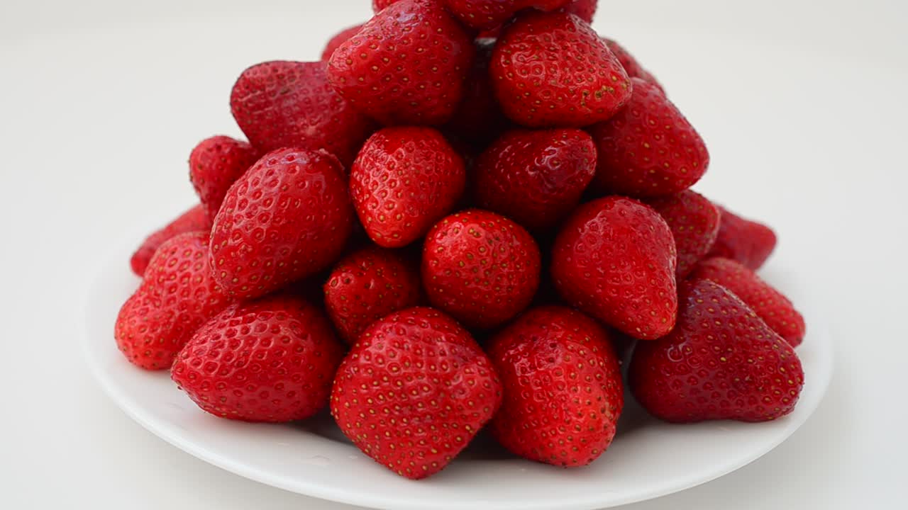 Strawberry on a white background, isolate. Shooting in the movement