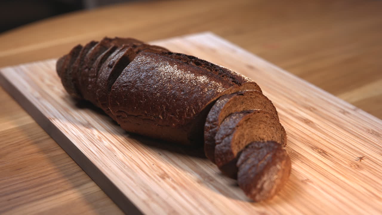 Cutting bread on a wooden board