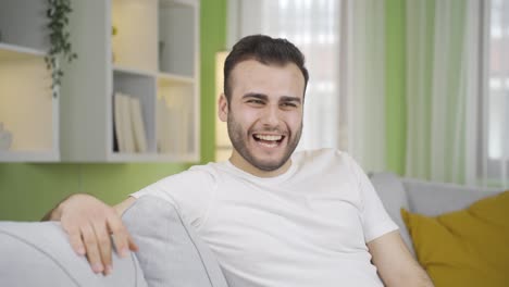 the happy and cheerful young man is in good spirits.