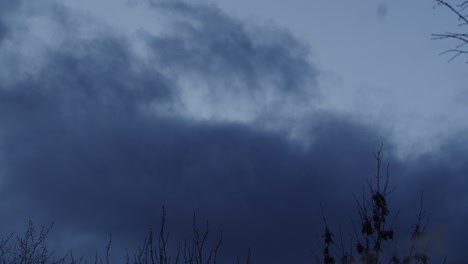 dark blue sky, timelapse. flowing scary clouds in evening, bad weather. halloween theme