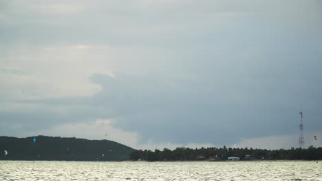 Surat-Thani-Province,-Thailand---Kite-Surfers-Delighting-in-the-Scenic-Charm-of-Koh-Pha-ngan---Static-Shot