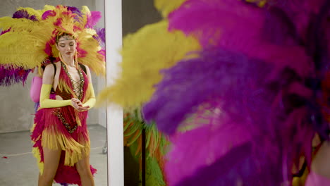 showgirl dancing in front of a mirror