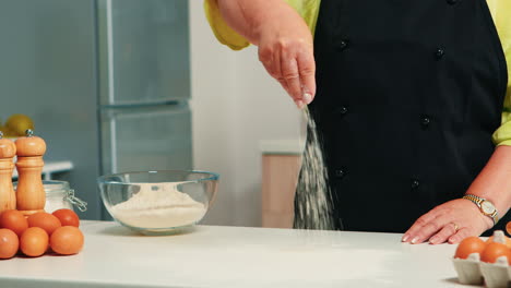 close up of spreading flour