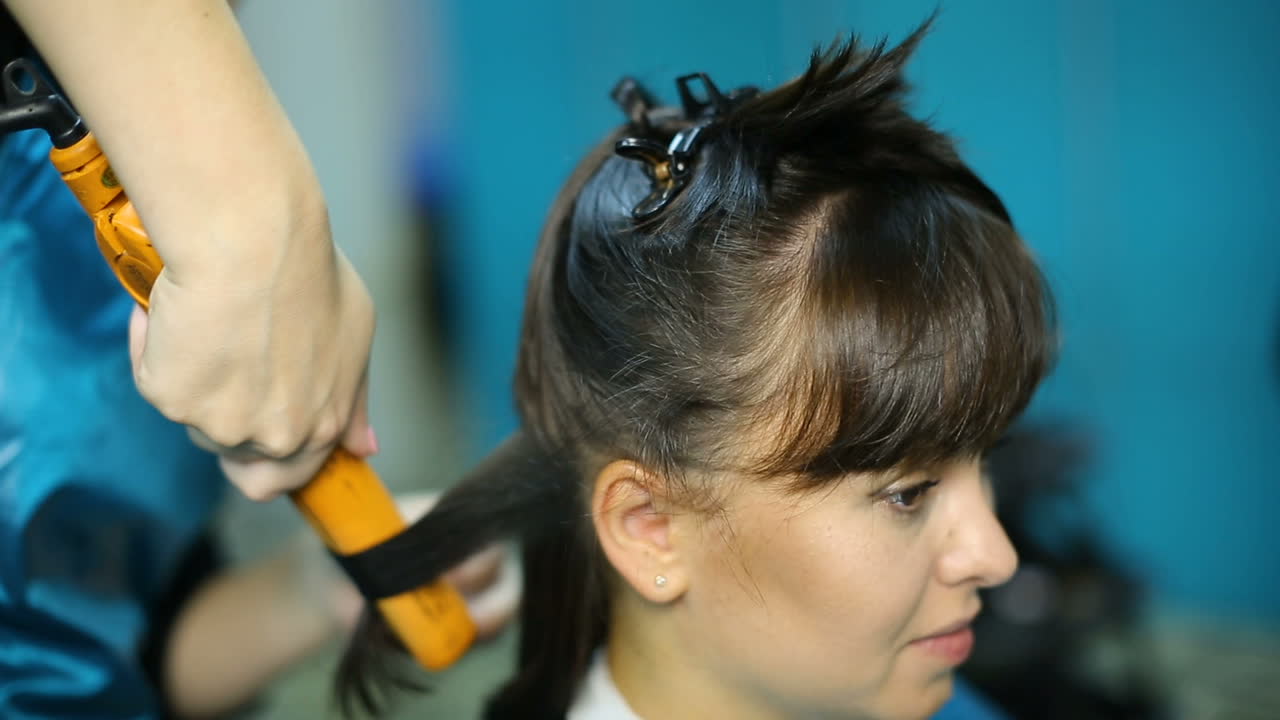 Young woman and hairdresser making styling hair at beaty salon