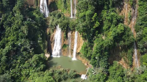 A-nice-drone-shot,-flying-toward-Thi-Lo-Su-Waterfall,-located-off-the-beaten-track-in-the-backpacker-country-of-Thailand-in-the-area-of-Umphang-in-Southeast-Asia