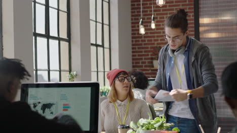 young business people working in startup office caucasian team leader man pointing at tablet computer screen showing colleague creative ideas training intern brainstorming discussing information