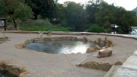 Establishing shot of Muiño da Veiga thermal baths in Ourense, Galicia, Spain