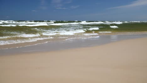 gentle waves on sandy beach